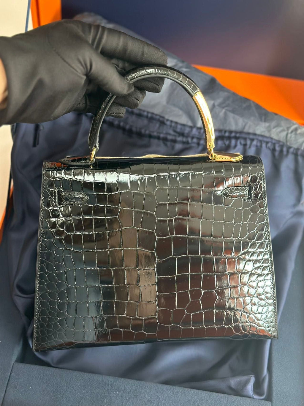Hermès Kelly Midas 25 Noir Shiny Crocodile Porosus 18k yellow gold hardware & handle