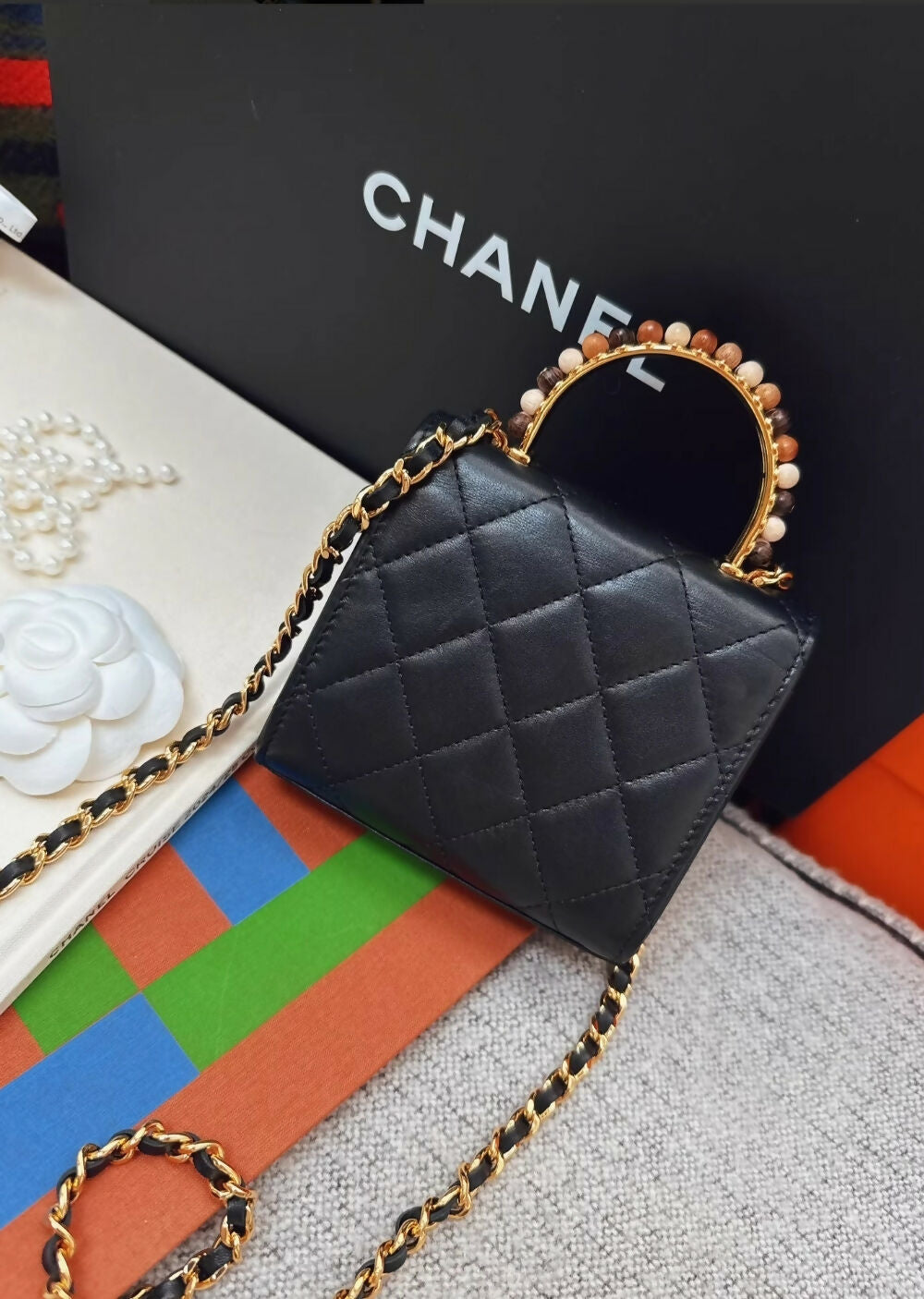 Chanel 23a Black Leather mini bag with gold top handle
