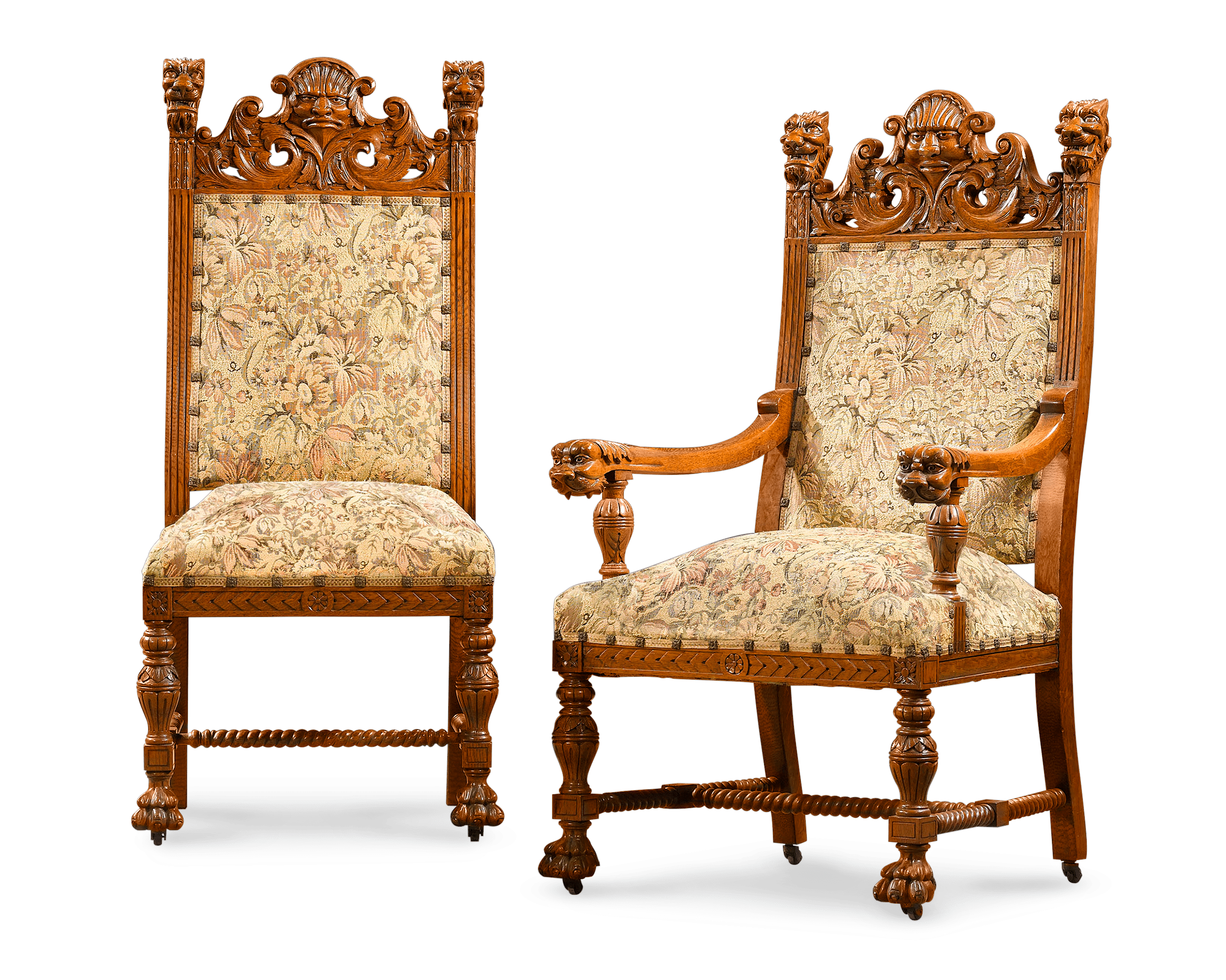 Chairs are covered in a lovely tapestry and carved with masks and lions