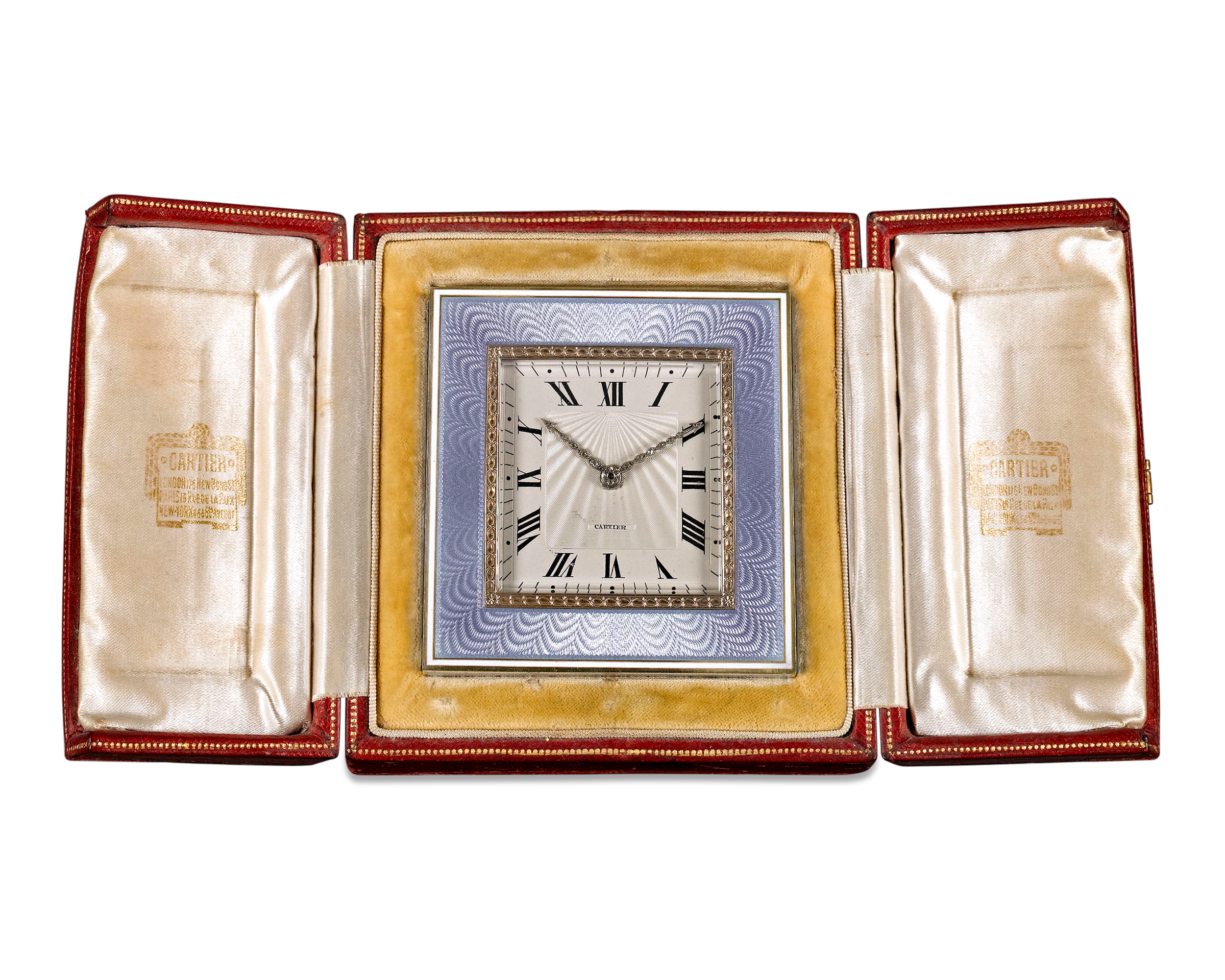 The clock can stand alone or be displayed in its original leather case