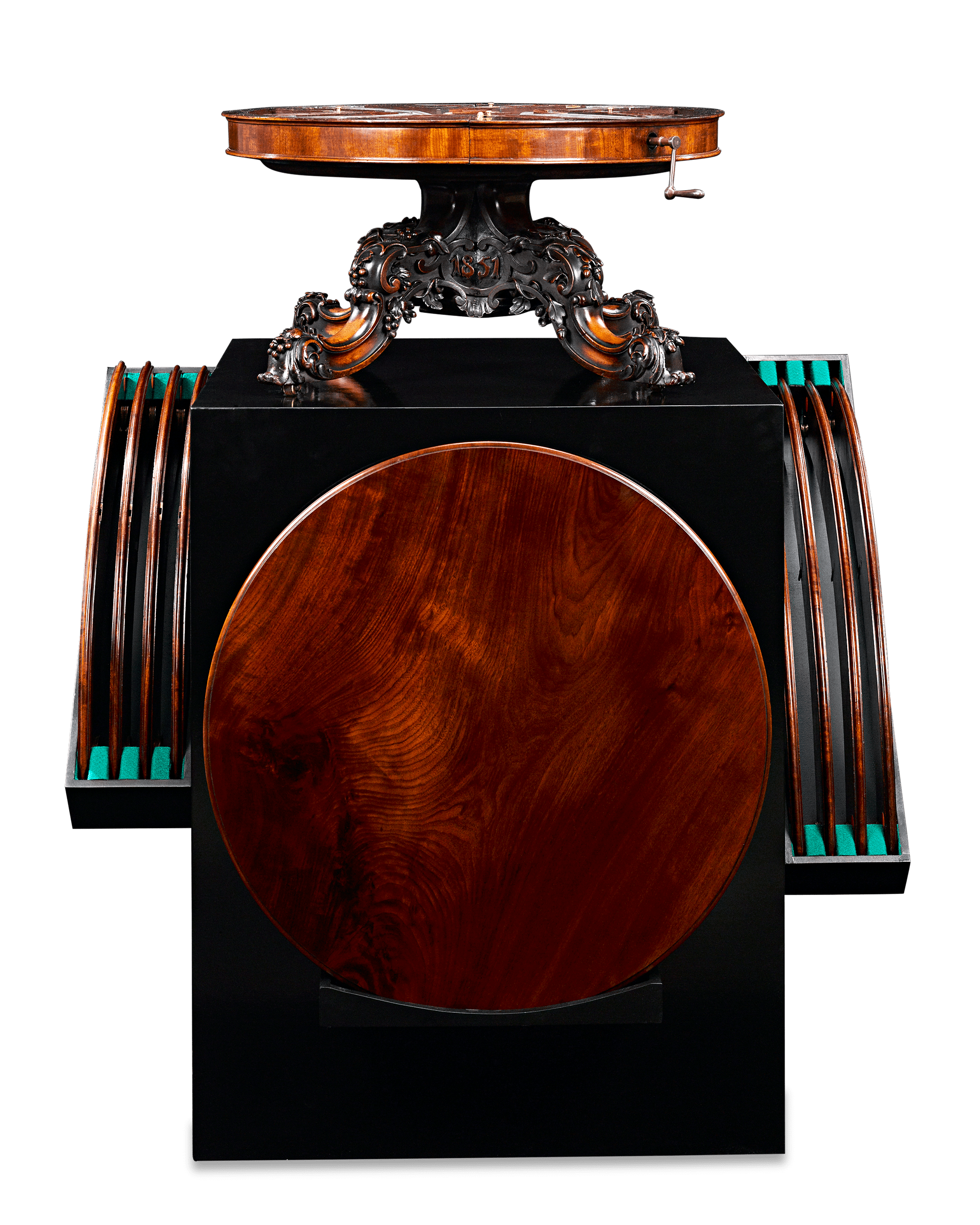 When the top is turned, its mechanism extends the table outward to accommodate additional leaves