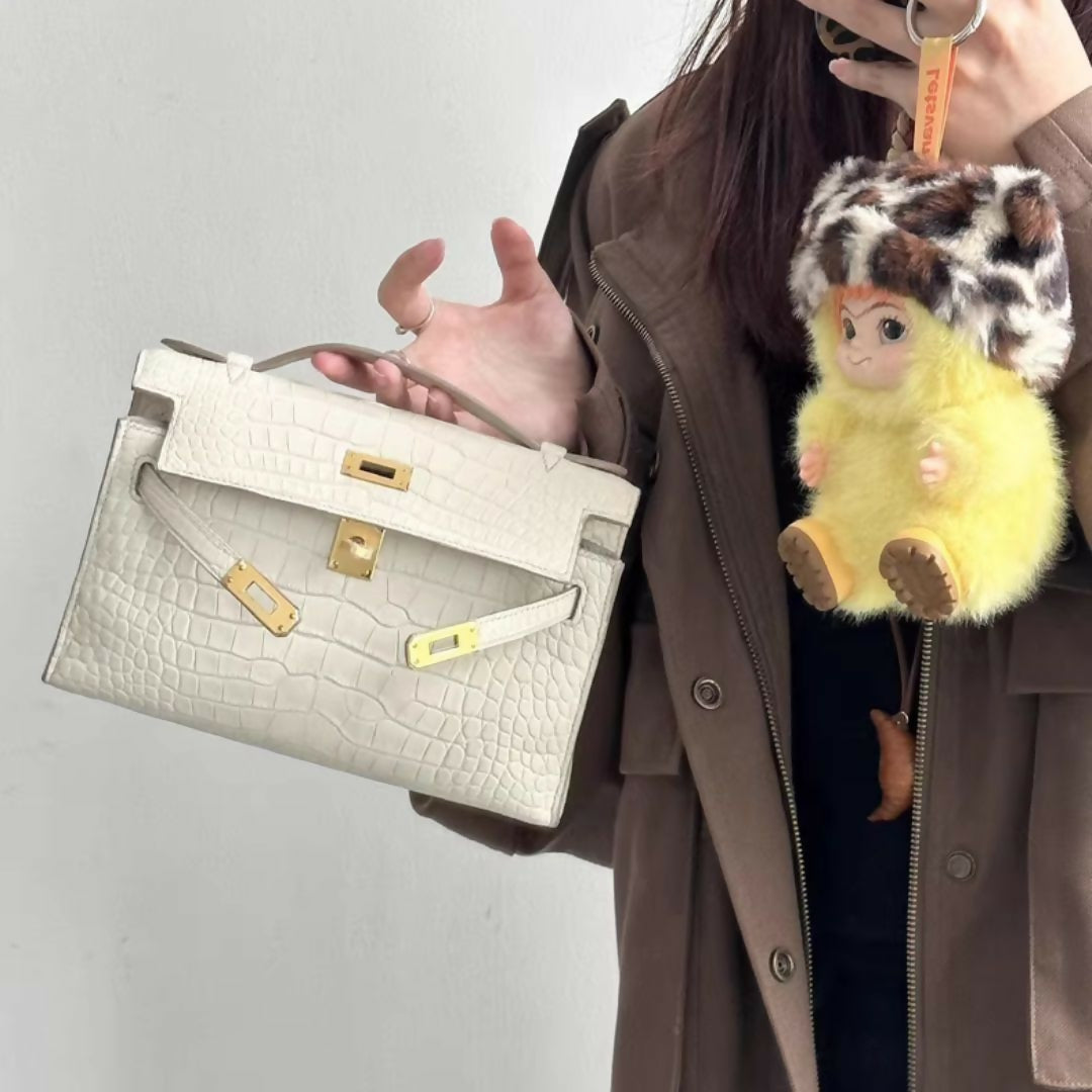 Hermès Kelly pochette Betton matte crocodile leather with gold hardware