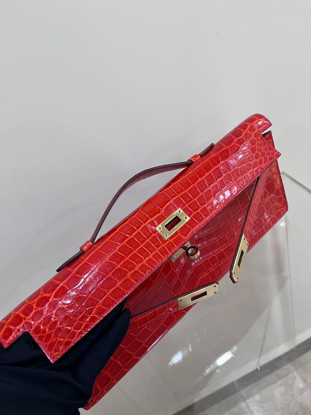 Hermes Kelly cut red shiny crocodile leather gold hardware