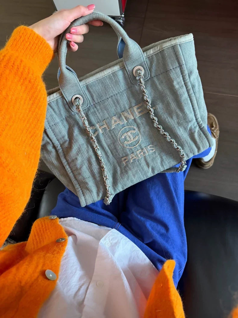 Chanel 23s beach bag in faded and distressed denim, small size