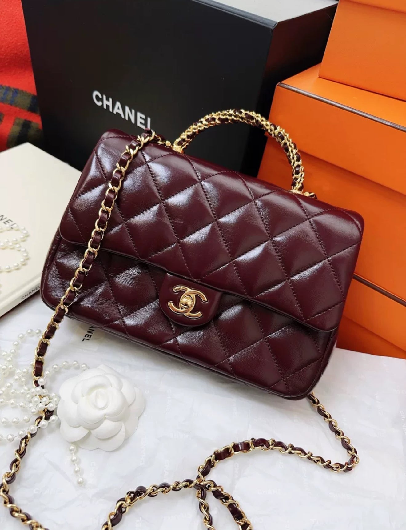 Chanel 24b burgundy sheepskin leather with gold chain top handle flap bag
