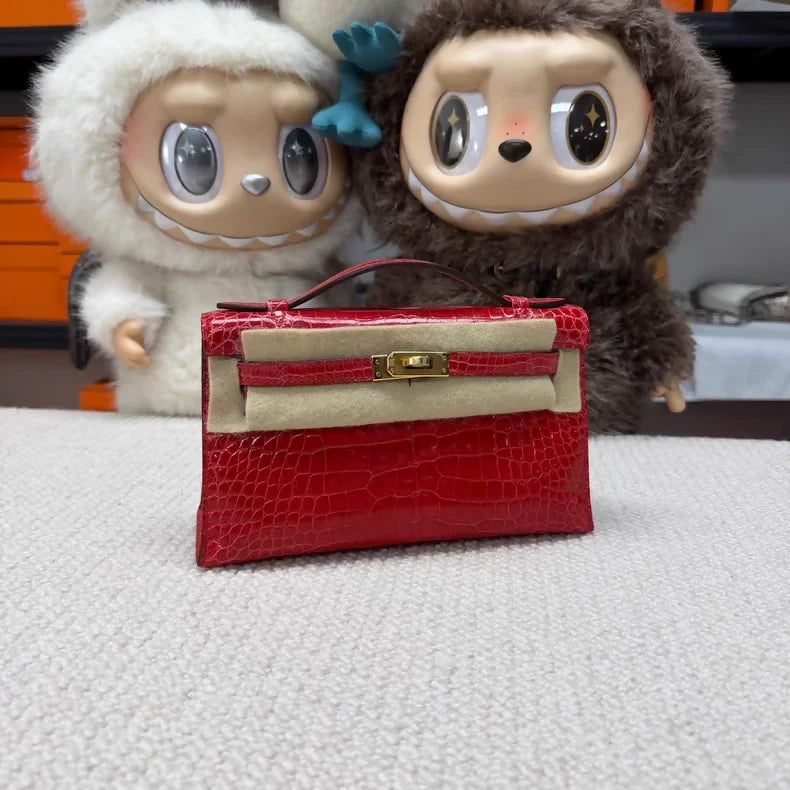 Hermes Kelly pochette red shiny crocodile leather gold hardware