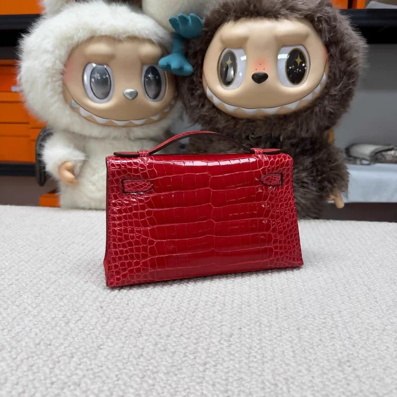Hermes Kelly pochette red shiny crocodile leather gold hardware