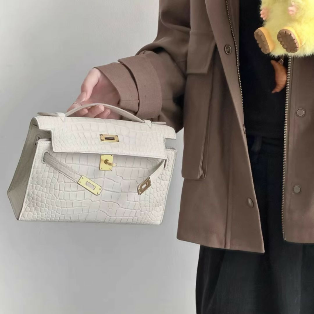 Hermès Kelly pochette Betton matte crocodile leather with gold hardware