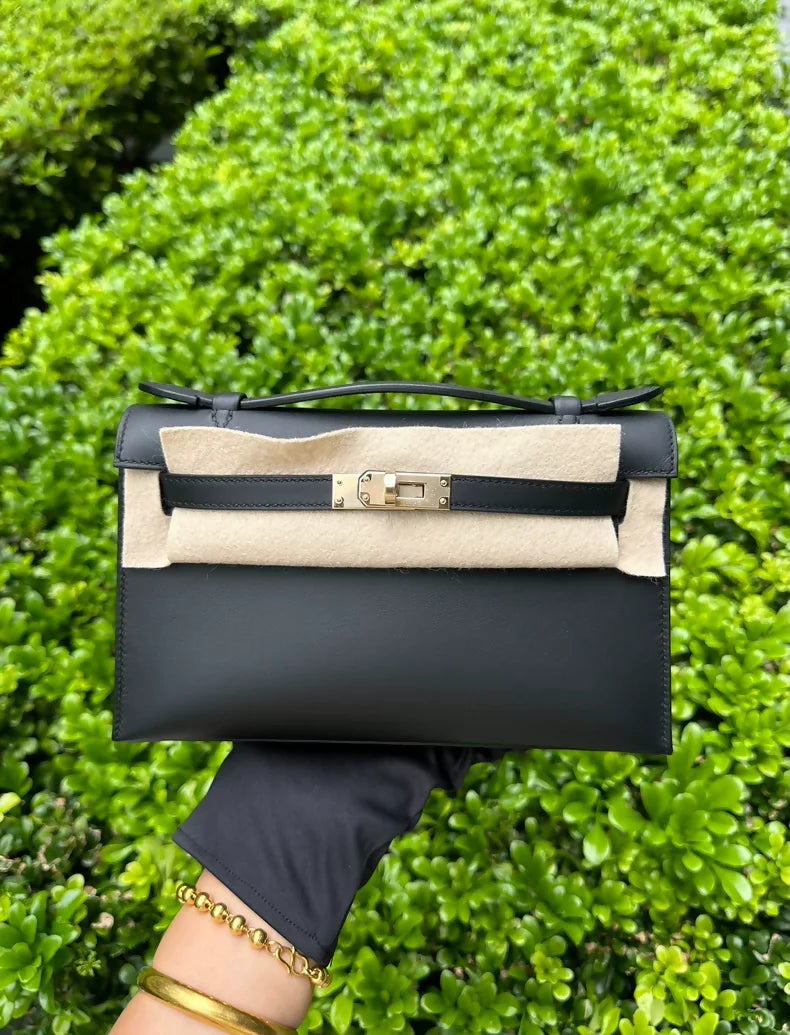 Hermès Kelly pochette black swift leather with light gold hardware