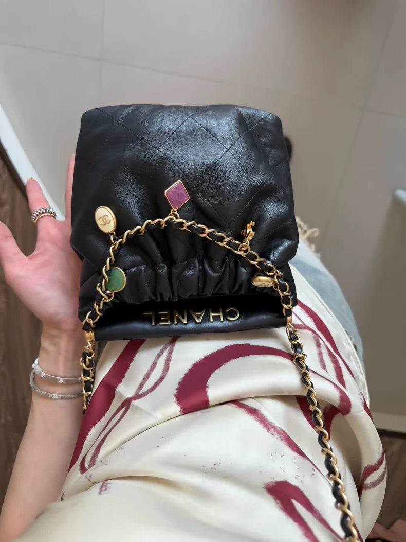 Chanel 23P black leather bag with Charms